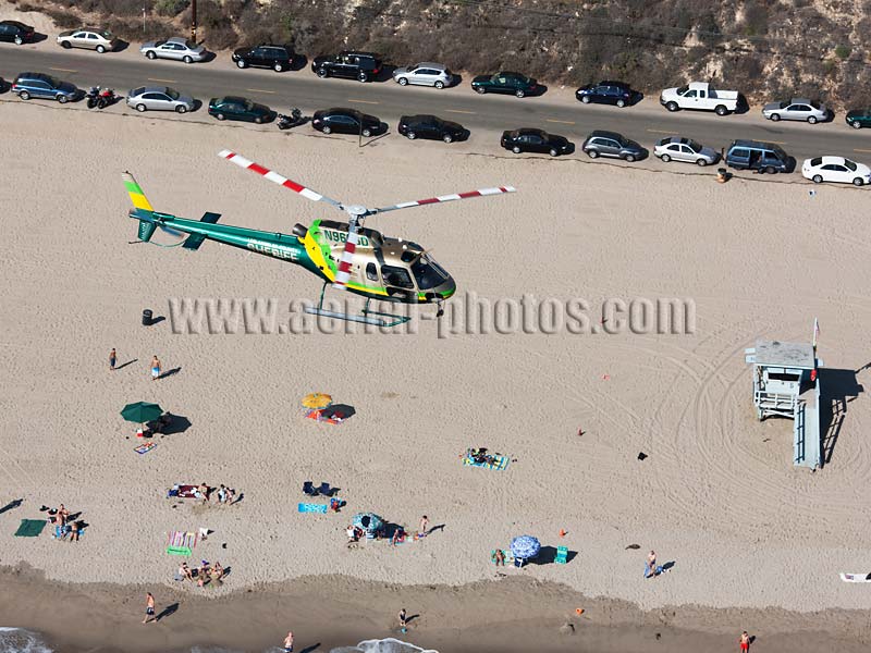 Aerial view of the AS350 Eurocopter on patrol, Los Angeles County Sheriff helicopter. Malibu Beach, California, USA.
