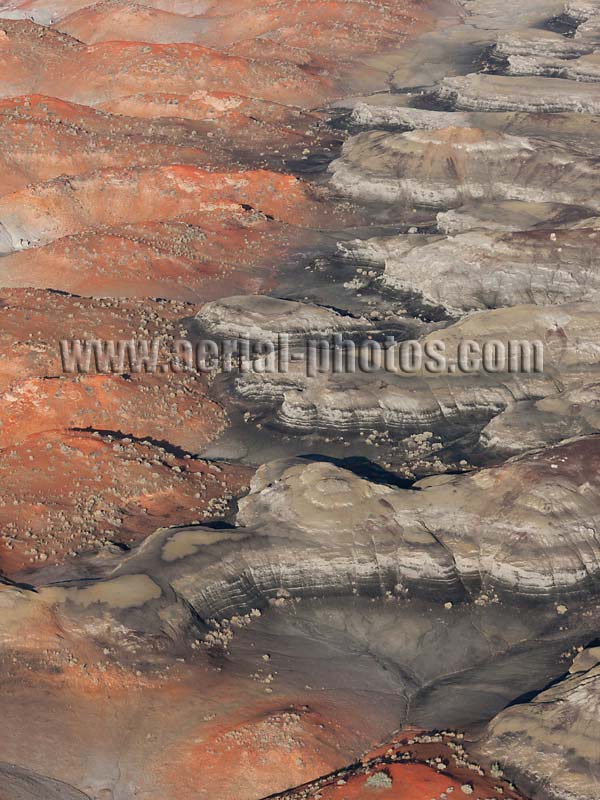Aerial view of black and red mounds, badlands at Bisti De-Na-Zin Wilderness, New Mexico, United States.
