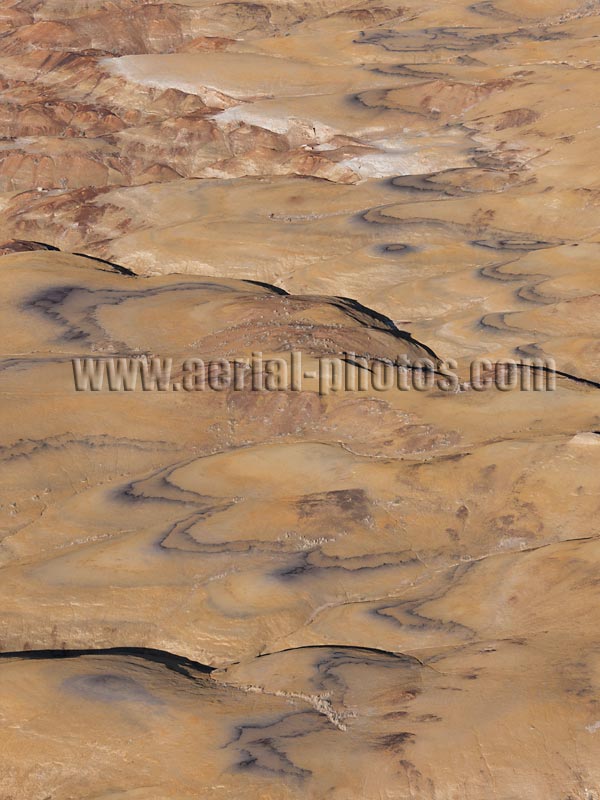 Aerial view of a coal seam in badlands, Bisti De-Na-Zin Wilderness, New Mexico, United States.