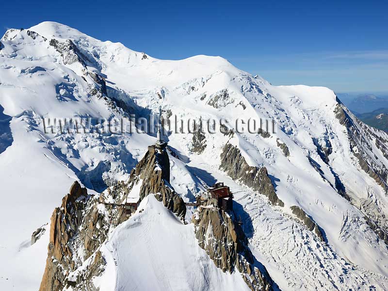 Aerial view. Photo of Mont-Blanc and Aiguille du Midi, Haute-Savoie, Auvergne-Rhône-Alpes, France. Vue aérienne.