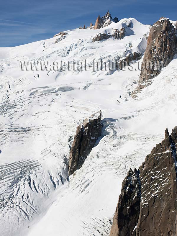 Aerial view. Photo of Aiguille du Midi and Vallée Blanche, Chamonix, Haute-Savoie, Auvergne-Rhône-Alpes, France. Vue aérienne.
