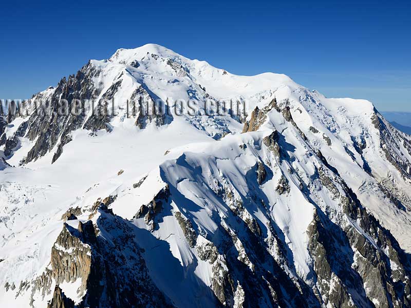 Aerial view. Photo of Mont-Blanc and Aiguille du Midi, Haute-Savoie, Auvergne-Rhône-Alpes, France. Vue aérienne.