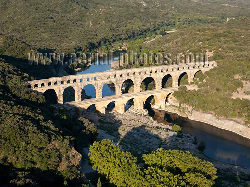 AERIAL VIEW photo of a roman aqueduct bridge, Pont du Gard, Languedoc-Roussillon, Occitanie, France. VUE AERIENNE pont-aqueduc romain.