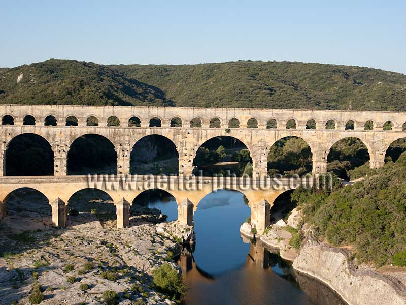 AERIAL VIEW photo of a roman aqueduct bridge, Pont du Gard, Languedoc-Roussillon, Occitanie, France. VUE AERIENNE pont-aqueduc romain.