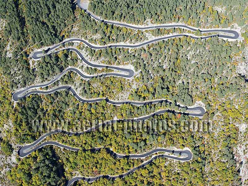 AERIAL VIEW photo of a winding road in Guillaumes, French Alps, France. VUE AERIENNE route en lacets, Alpes-Maritimes, Alpes Françaises.