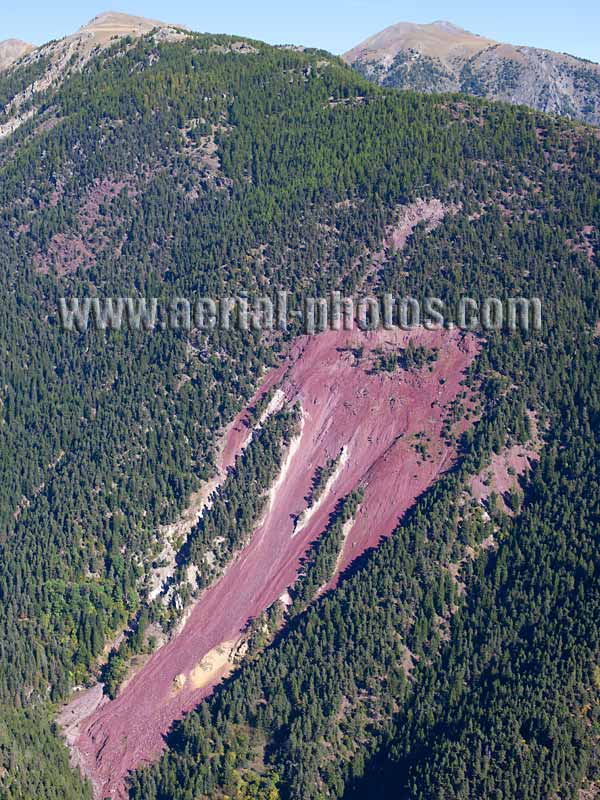 Aerial view of a landslide showing some red rock in the French Alps. Vue aérienne.