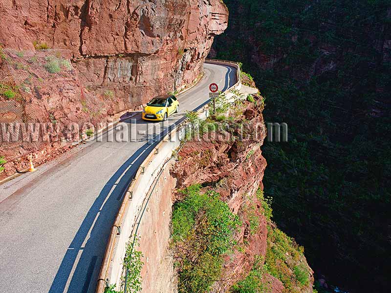Aerial view of a car in the Gorges du Cians in the Alps, France. Vue aérienne.