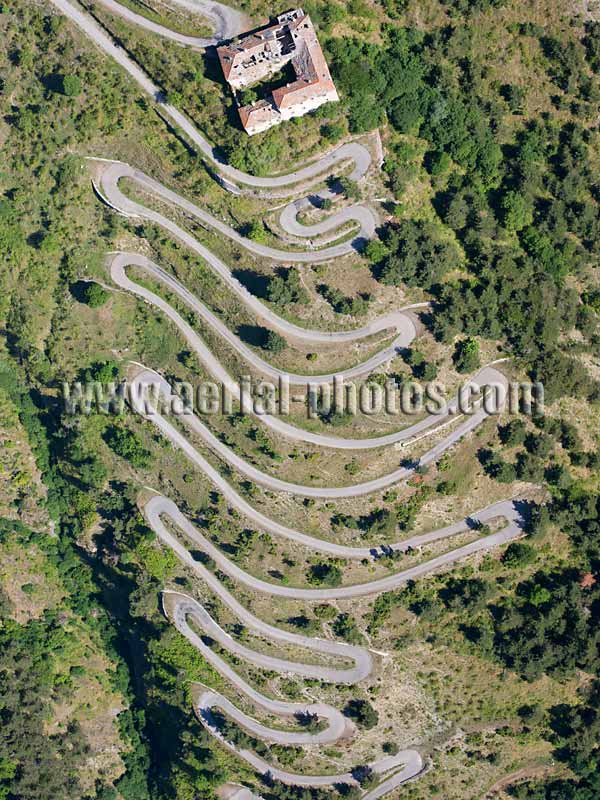 Aerial view of road with switchbacks near the Col de Tende in the Alps, France. Vue aérienne.