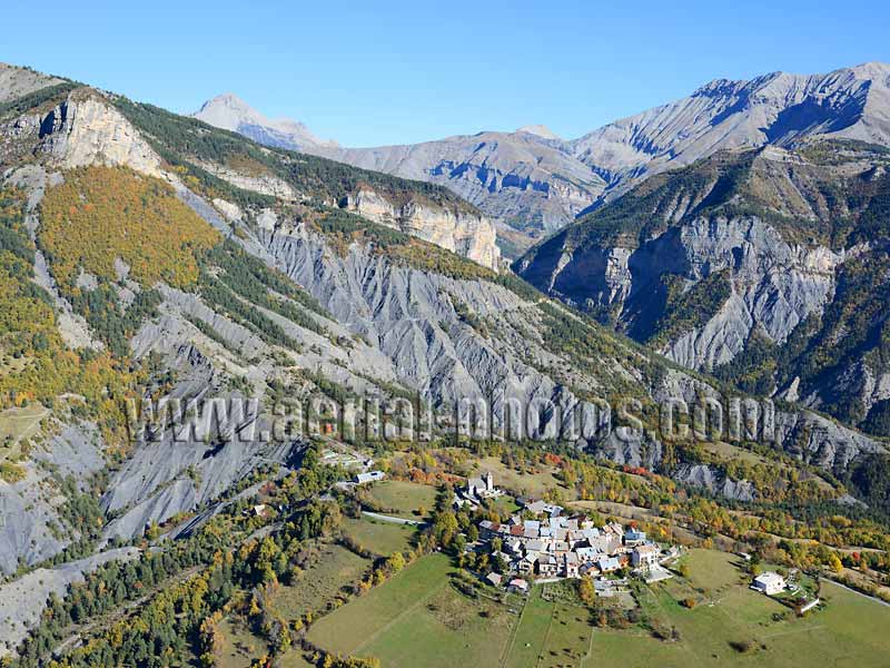 Aerial photo of a hilltop village in the Alps, Châteauneuf d’Entraunes in France. Vue aérienne.