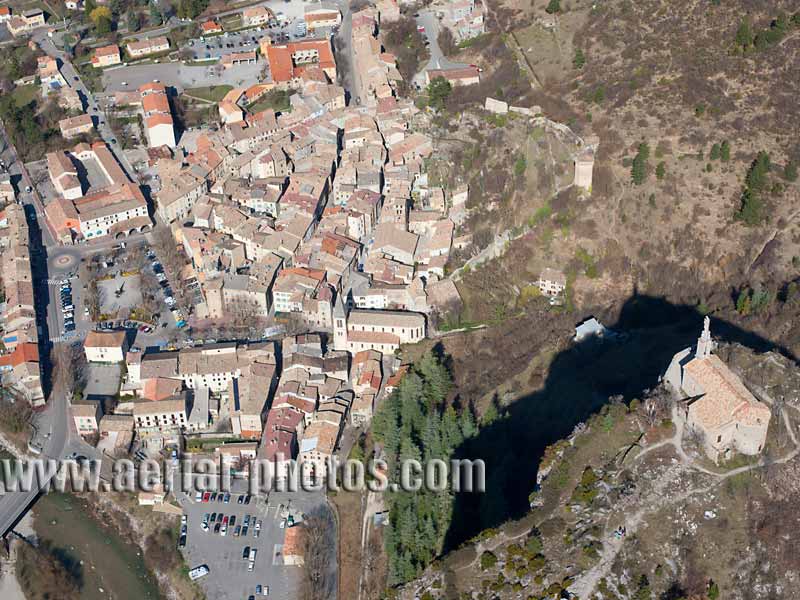 Aerial view of a chapel overlooking the historic town of Castellane, French Alps. Vue aérienne.