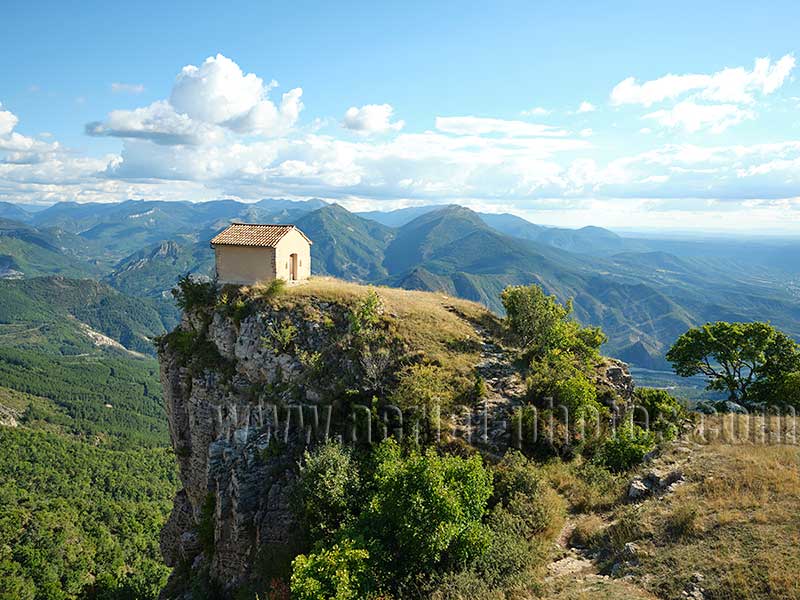 Aerial view of Saint-Michel-de-Cousson, a small church on a cliff's edge near Digne-les-Bains in the French Alps. Vue aérienne.