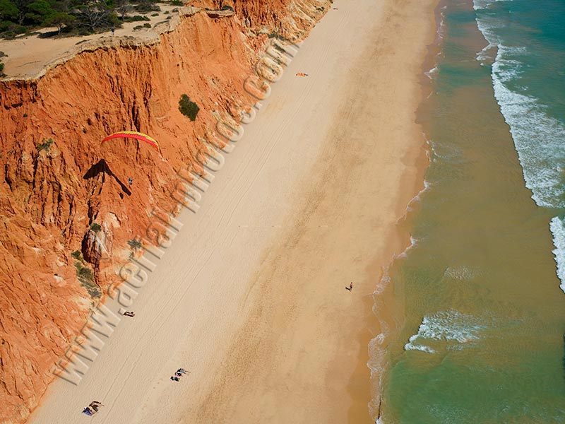 AERIAL VIEW photo of a paraglider, Falésia Beach, Albufeira, Algarve, Portugal. VISTA AEREA parapente, Praia da Falésia.