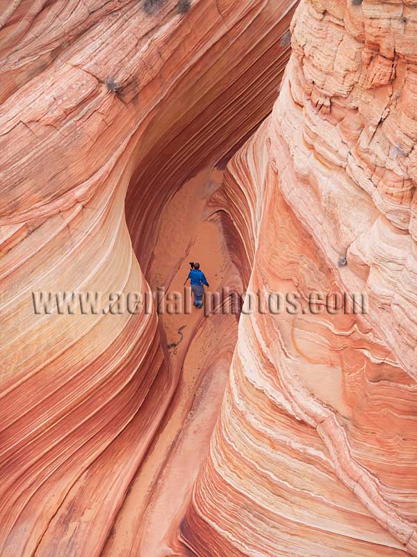 Aerial view of a photographer in the Wave, North Coyote Buttes, Arizona, Colorado Plateau, USA.