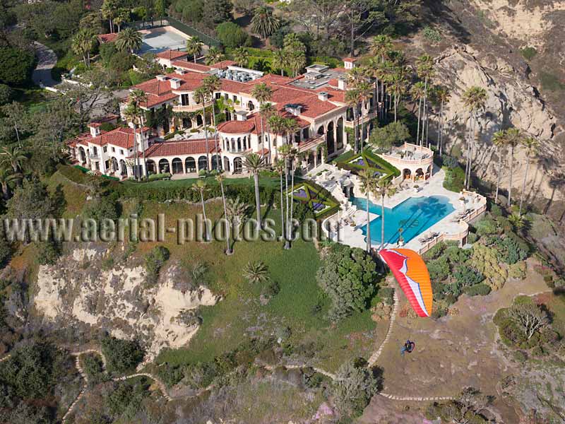 Aerial view of a paraglider and a large house, Torrey Pines, La Jolla, San Diego, California, USA.