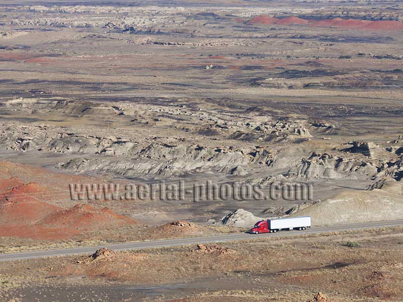 Aerial view of a truck in a desertic landscape, Bisti De-Na-Zin Wilderness, New Mexico, United States.