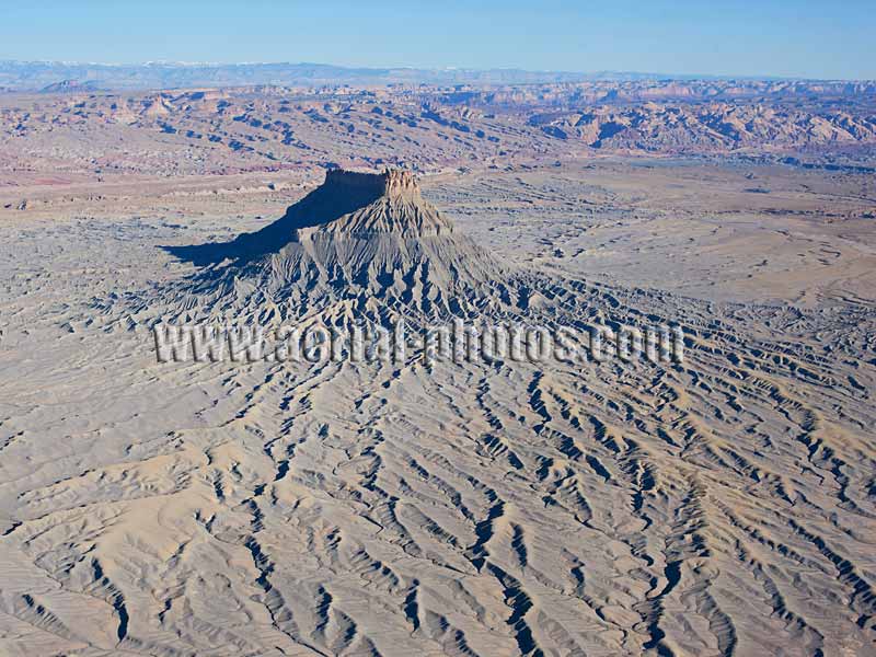 Aerial view of an isolated eroded mesa, Factory Butte, Caineville, Utah, USA.